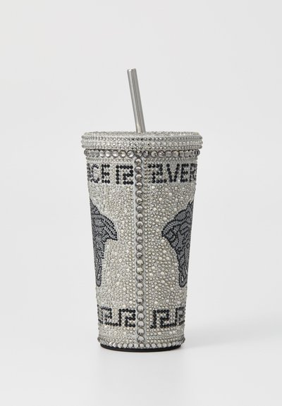 Decorative tumbler with a silver metallic finish, adorned with black and clear rhinestones, featuring animal graphics and a metal straw.