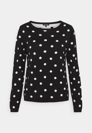 Schwarzer Langarmpullover mit rundem Ausschnitt und weißen Punkten, die gleichmäßig über Körper und Ärmel verteilt sind.