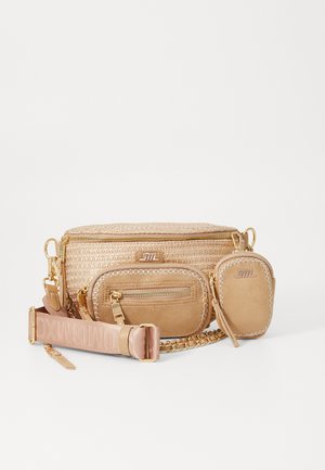 Tan woven crossbody bag with a textured straw body, gold hardware, zippered pockets, and a removable shoulder strap featuring logo detailing.
