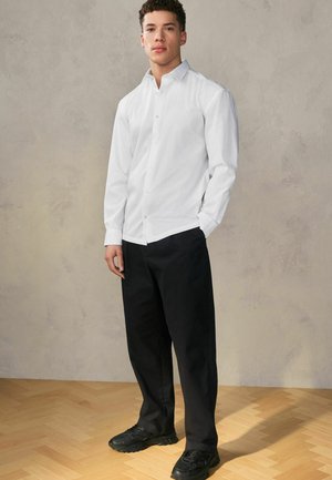 EDIT - REGULAR FIT - Trousers - black