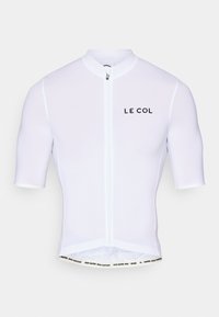 Maillot de cyclisme blanc à manches courtes, avec fermeture éclair à l'avant et logo "LE COL". Tissu lisse avec une coupe ajustée et un texte sur la ceinture contrasté.