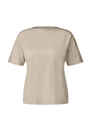 Beige short-sleeved t-shirt featuring a round neckline and metallic studs along the shoulder seams, made of soft, smooth fabric.