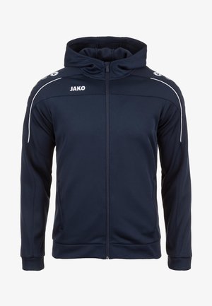 Navy Athletic-Jacke mit frontalem Reißverschluss, Kapuze und weißen Akzentstreifen an den Ärmeln. Mit "JAKO"-Logo auf der linken Schulter.