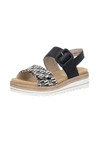 Sandale noire et blanche à bout ouvert avec une bride avant tissée, une bride de cheville noire avec boucle, une semelle intérieure rembourrée beige et une semelle extérieure blanche rainurée.