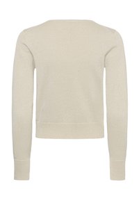 Pull en maille beige avec des manches longues, un encolure arrondie et une coupe cropped. Le tissu présente un léger scintillement et une texture lisse.
