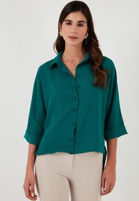 Unselected, emerald green