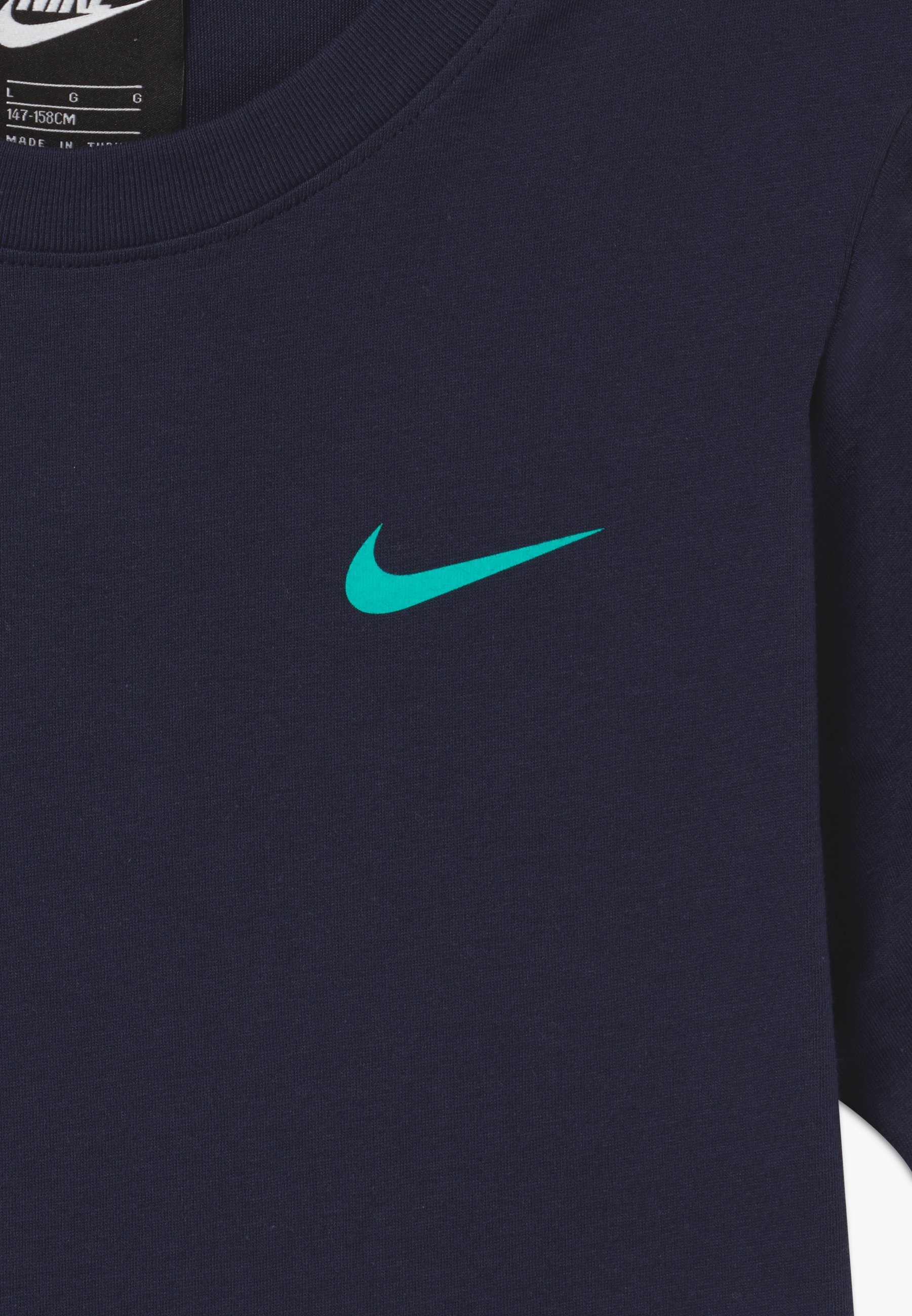 aurora green nike shirt