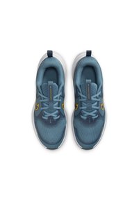 Blue mesh athletic shoes with yellow accents, flat laces, and a textured sole. Features a back tab and streamlined, modern design.