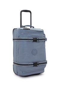 Kompakt rullande ryggsäck i fast ljusblått tyg, med svarta detaljer, en teleskophandtag och justerbara axelremmar med spännen.