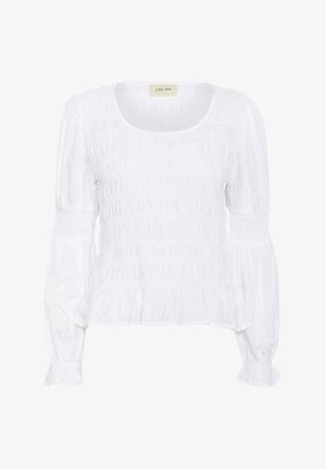 Valge pluus, millel on elastse tekstuuriga detail, ümara kaelusega ja pikad puhvvarrukad. Vöökoht ja mansetid on kogutud kangaga, mis annab vormitud ilme.