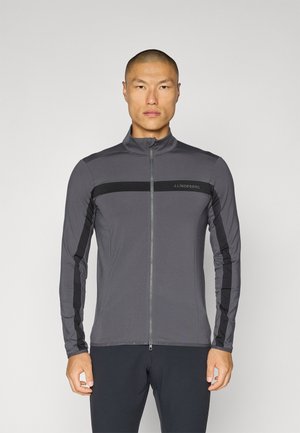Gray long-sleeve zip-up jacket with black accents and a standing collar. Features a logo on the chest and fitted design for ease of movement.