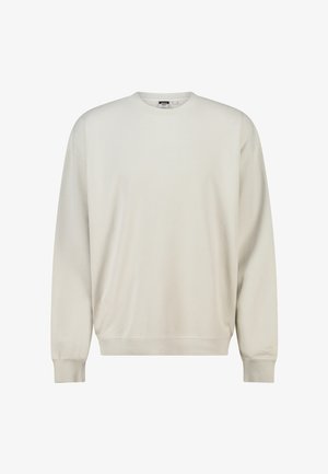 Sweat-shirt beige clair à manches longues, col rond, poignets côtelés et coupe décontractée. Confectionné en coton doux et lisse.