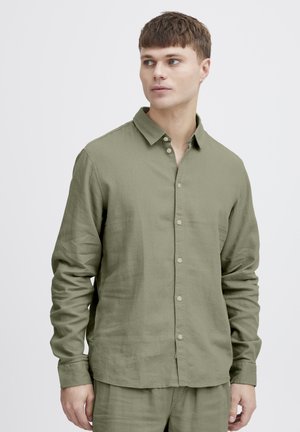 Olive green long-sleeve shirt in a lightweight, textured fabric with a button-down front, featuring a classic collar and cuffs.