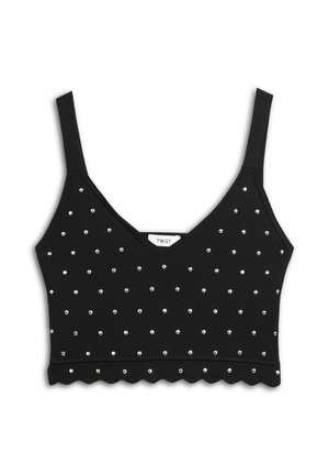 Top court noir avec un décolleté en V profond, ornée de clous en argent disposés en motif quadrillé et d'un ourlet en forme de vagues. Fabriqué en tissu stretch.