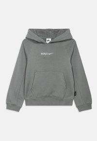 Grey Nike hoodie with front pocket and "BARÇA" logo beside the Nike swoosh on the chest, featuring a hood and long sleeves.