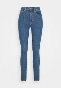 Jeans skinny de talle alto en color azul, elaborados en denim. Cuentan con una cremallera frontal y cierre de botón, además de dos bolsillos delanteros. Textura uniforme en toda la prenda.