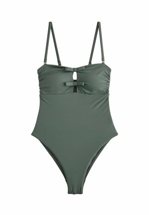 Costume intero verde con spalline regolabili, dotato di un'apertura a chiave frontale e due fiocchi decorativi sul seno. Tessuto morbido.