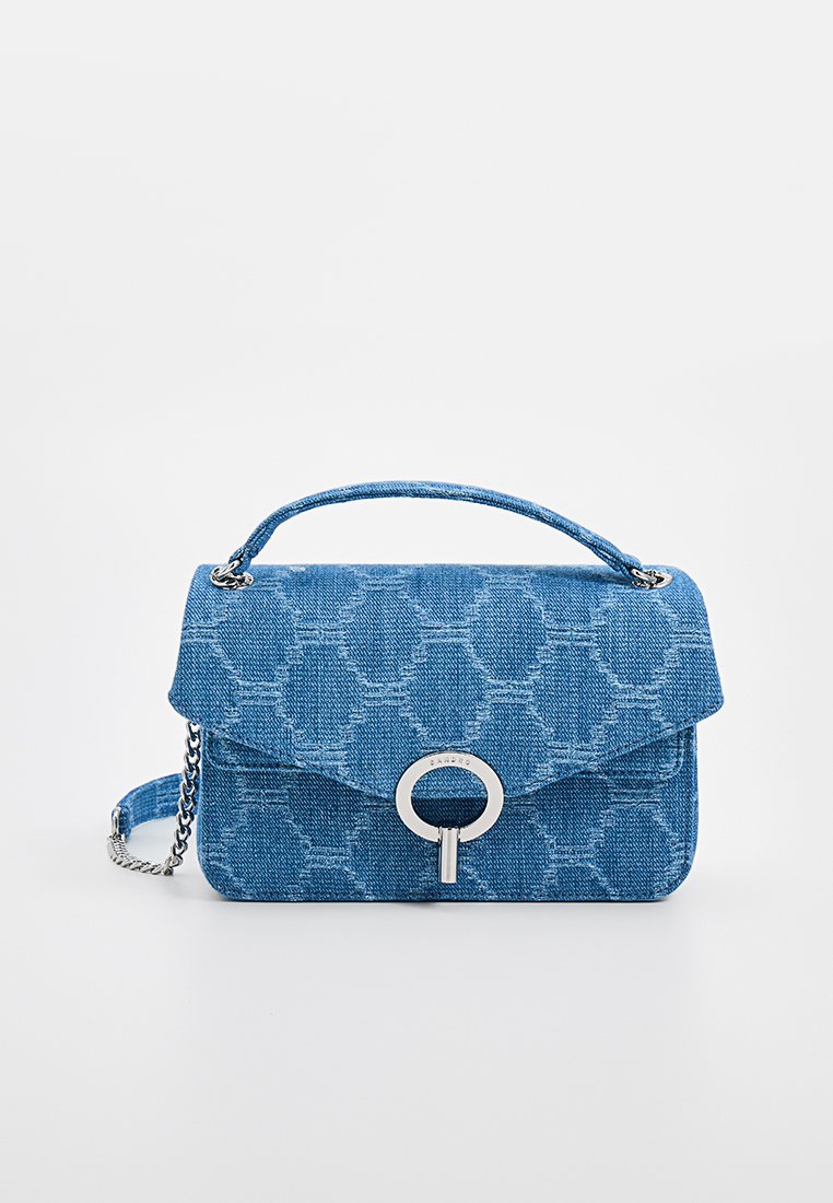 Blue denim handbag with textured hexagonal pattern, silver circular hardware, top handle, and adjustable chain strap.