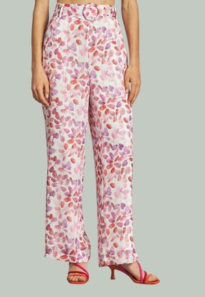 Blumenmuster-Hosen in Weiß mit pinken und lila Blattmustern. Mit hoher Taille, einem runden Gürtelverschluss und weitem Bein geschnitten.