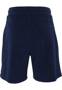 Shorts in pile blu navy con vita elastica, dotati di una tasca sul retro e una superficie liscia. Design di lunghezza medio-coscia.