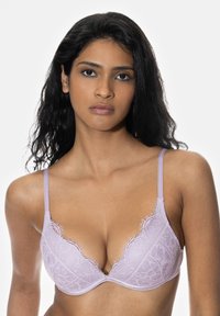 Lavender lace bra with a plunging neckline, delicate scalloped edges, and thin adjustable straps. Soft texture, intricate floral pattern.