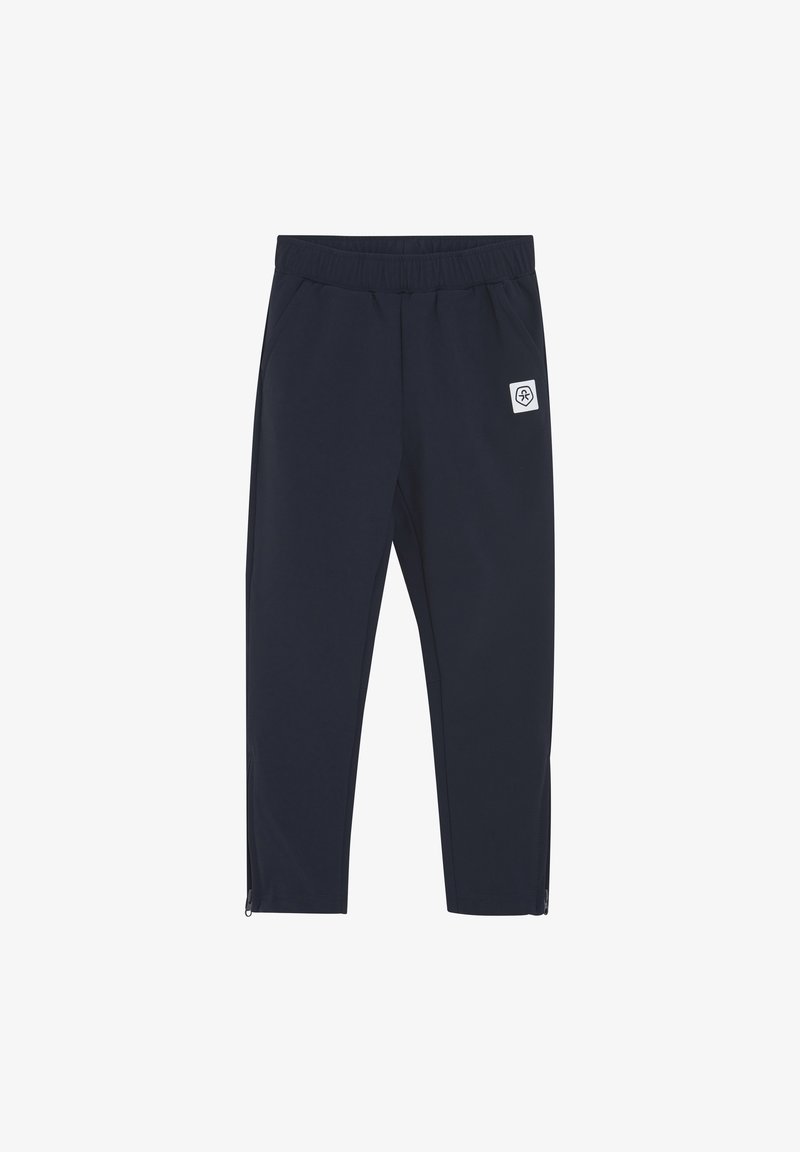 Marineblaue Sporthosen mit einem elastischen Bund, Seitentaschen und einem Reißverschluss am Saum. Enthält ein weißes Logo-Patch an der Oberschenkeloberseite.