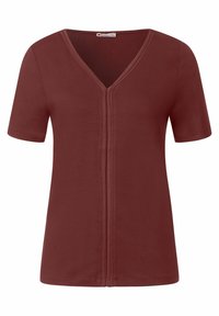 Krátký rukáv vínově červený top s véčkovým výstřihem a zapínáním na zip vpředu. Vyrobeno z měkké, hladké tkaniny s volným střihem.