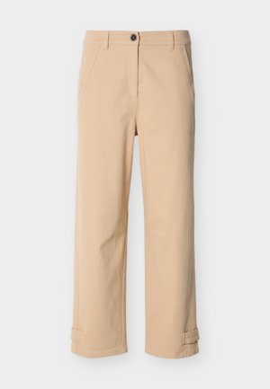 Beige straight-leg pants with front pockets, belt loops, button closure, and adjustable straps at the hem, displayed on white background.