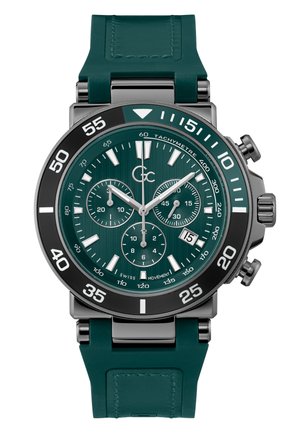 Groene chronograaf horloge met een getextureerde wijzerplaat, roestvrijstalen kast en zwarte bezel. De rubberen band en zilveren accenten versterken het moderne ontwerp.