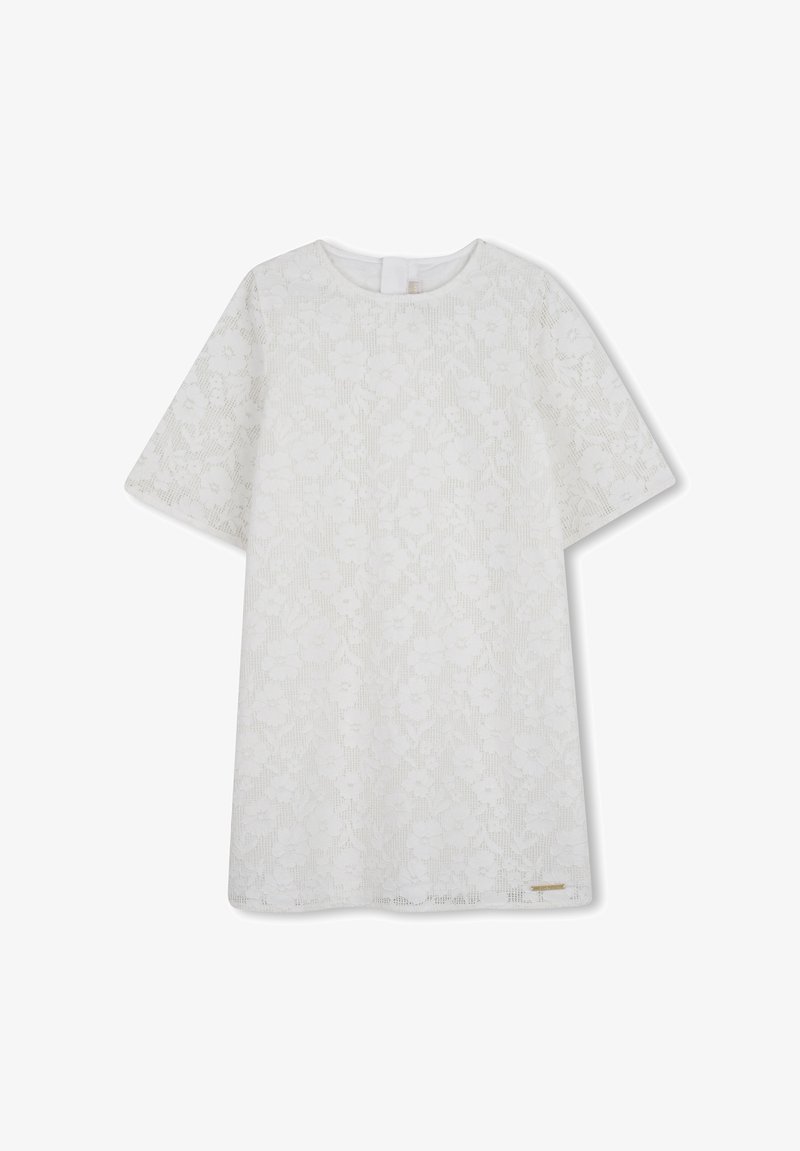 Haut en dentelle florale blanche avec manches courtes, encolure ronde et motif texturé. Comprend une petite étiquette dorée en accent au bas.