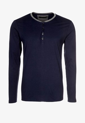 Long-sleeve navy blue henley shirt with a gray collar, featuring a buttoned placket and ribbed cuffs. Soft fabric with a smooth texture.