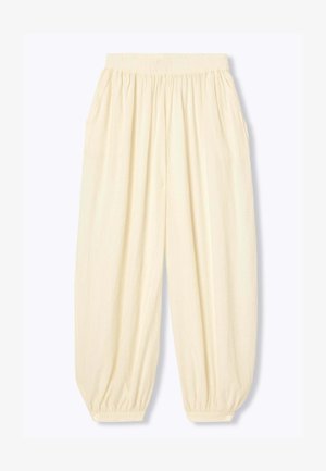 Pantalon ample de couleur crème avec taille élastique et poignets élastiques boutonnés, avec poches latérales et tissu texturé.