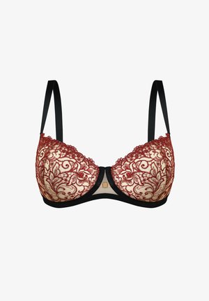 Koronkowy biustonosz z czerwonymi kwiatowymi haftami na beżowym tle, czarnymi ramiączkami, dekoltem w kształcie litery V i złotymi akcentami na środku.