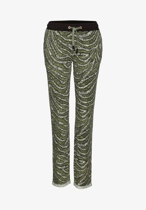 Grüne Lounge-Hose mit Muster, ausgestattet mit einem schwarzen elastischen Bund, Kordelzug-Detail und einem lockeren Schnitt mit einer strukturierten, wellenförmigen Gestaltung.