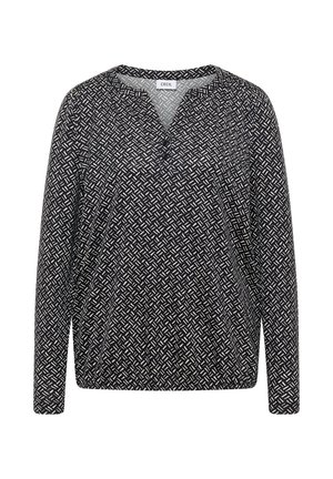 Maglietta a maniche lunghe con un motivo geometrico bianco e nero, caratterizzata da una scollatura a V e una vestibilità rilassata, realizzata in tessuto leggero.