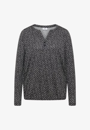 Langarmtop met een zwart-wit geometrisch patroon, met een V-halslijn en een relaxte fit, gemaakt van lichte stof.