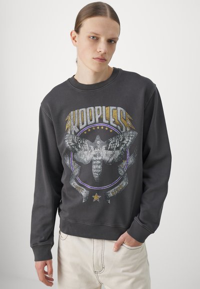 Gray sweatshirt with a round neck, featuring a large moth graphic and "KOOPLESS" text in silver and gold. Cotton blend with ribbed cuffs.