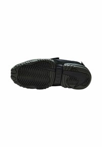 Svart atletisk skosula med texturerad gummi och vågiga mönster; har luftkuddar och formade detaljer för grepp och stöd.