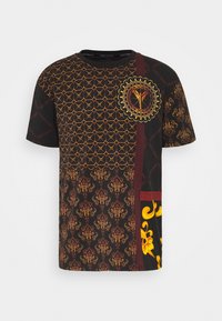 Black short-sleeve t-shirt featuring intricate orange geometric patterns, floral motifs, and gold accents on a textured fabric.