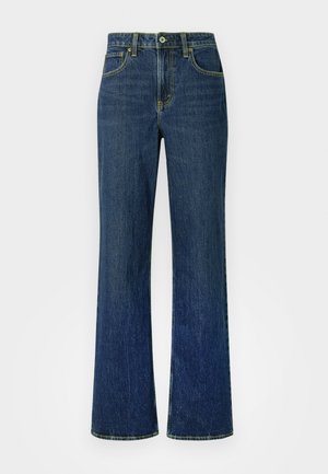 Lyse falmede mørkeblå denimjeans med høy midje, vide ben og klassisk design med fem lommer. Gule sømmer hele veien rundt.