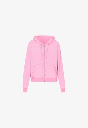 Haut à zip rose en tissu doux, avec une capuche à cordon, des poches avant et des poignets et un ourlet en maille côtelée. Texture lisse.