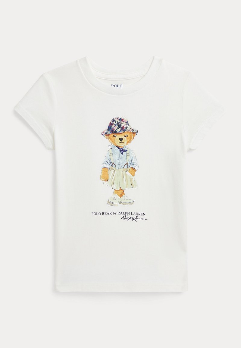 Camiseta de algodón blanca con un gráfico colorido de un oso con un sombrero de cuadros, camisa abotonada, falda y zapatillas, con el texto "Polo Bear by Ralph Lauren".