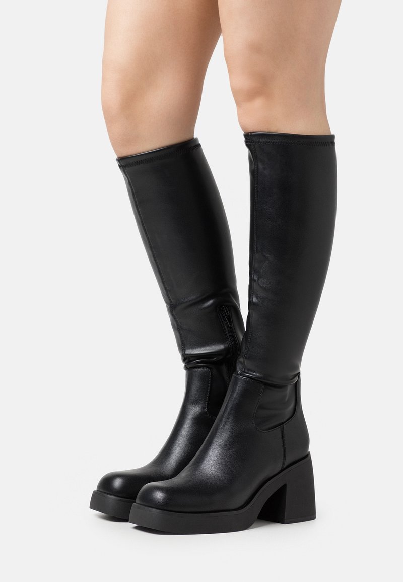 Black knee-high boots made of smooth leather, featuring a block heel and side zipper, with a fitted design and minimal stitching details.