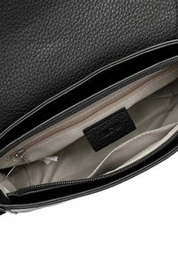 Black leather handbag with a textured surface, zippered closure, and light beige interior lining featuring a pocket and brand label.