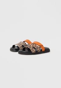 Leopard print slide sandals with orange and black straps, rubber sole, open toe design, and textured fabric accents.