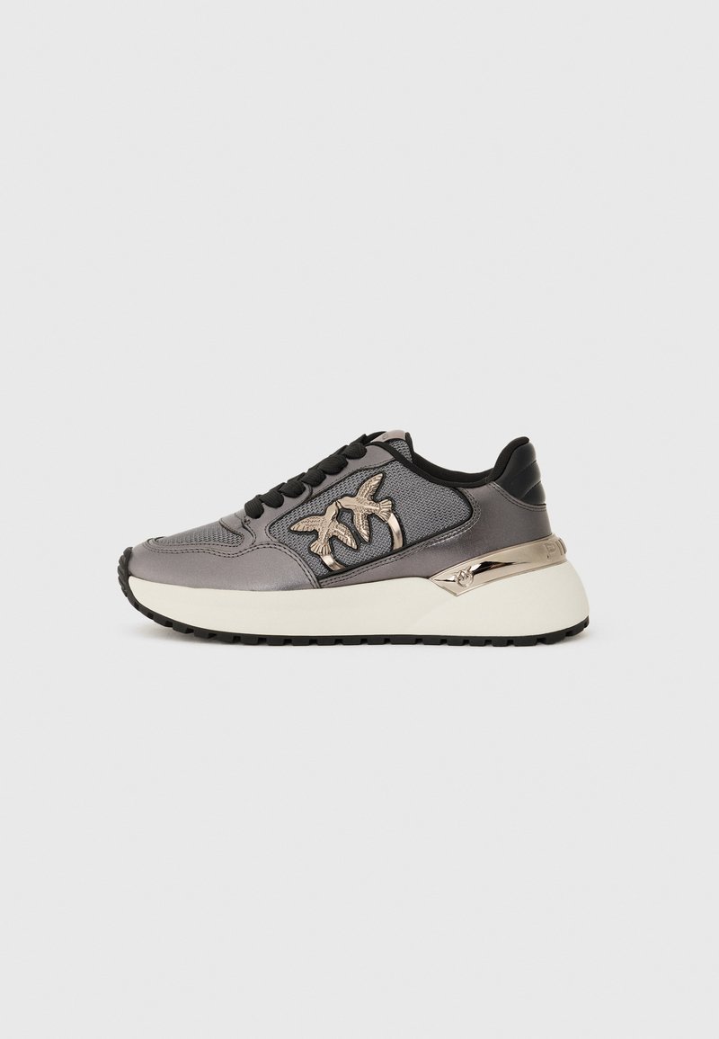 Gray sneaker with black laces, mesh panels, white thick sole, and metallic bird logos on the side, shown from the outer side.