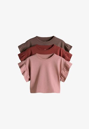 Drei kurzärmelige Rüschenoberteile übereinandergelegt, Farben von vorne nach hinten: Hellrosa, Rostrot und gedämpftes Braun.