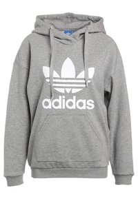 Šedá mikina s kapucí, přední kapsou, šňůrkou a bílým logem Adidas se třemi pruhy a designem trojlístku.