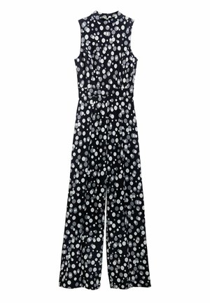 Schwarzer Jumpsuit mit weißen Punkten, ärmelloses Design, hoher Ausschnitt, tailliert und mit weiten Hosenbeinen. Glattes Material mit leichtem Glanz.