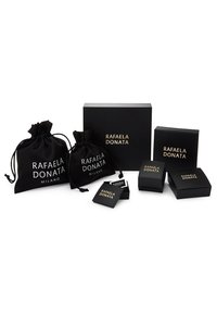 Three black fabric pouches and three boxes in varying sizes, featuring gold text "RAFAELA DONATA", on a plain white background.